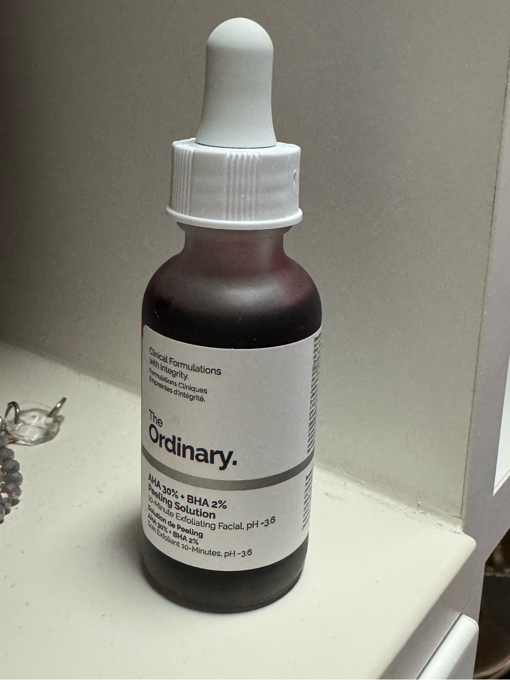The Ordinary brown bottle with white dropper cap